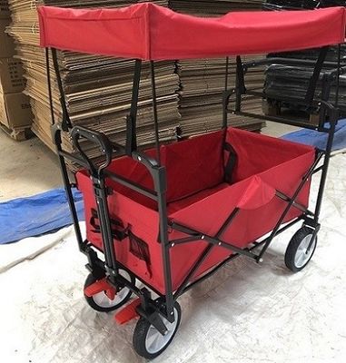 Les chariots pliants de chariot pliant rouge de chariot avec des roues couvrent la poignée de poussée